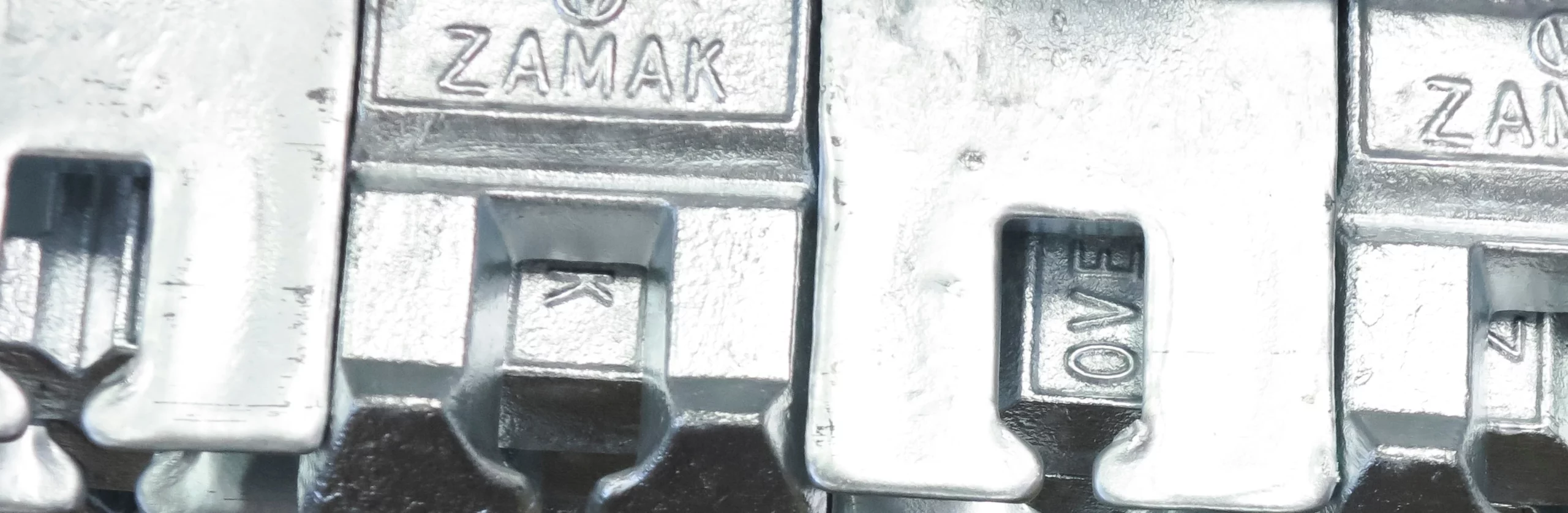 Bruschi: Precision Zamak & Aluminum Die Casting Components Close-up of high-precision Zamak and aluminum die-cast components manufactured by Bruschi, showcasing quality and detail.