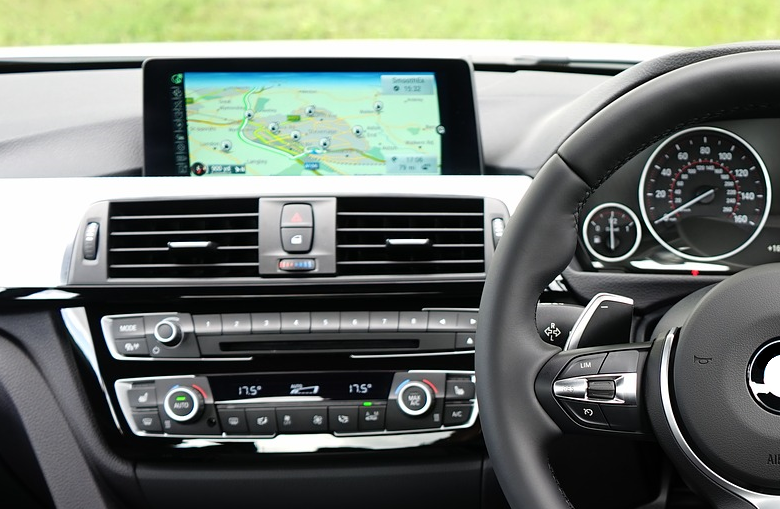 Close-up of a modern car's dashboard showcasing precision-engineered components, highlighting the quality and intricate details achievable through Bruschi's expertise in zinc and aluminum die-casting.