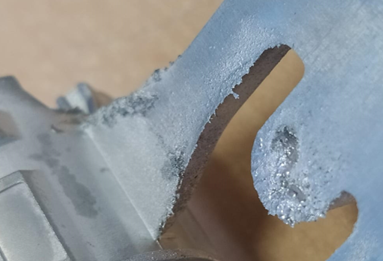 Close-up image showcasing the surface texture of a zinc (zamak) die-casting component produced by Bruschi. The image highlights the detail and precision of Bruschi's die-casting process.